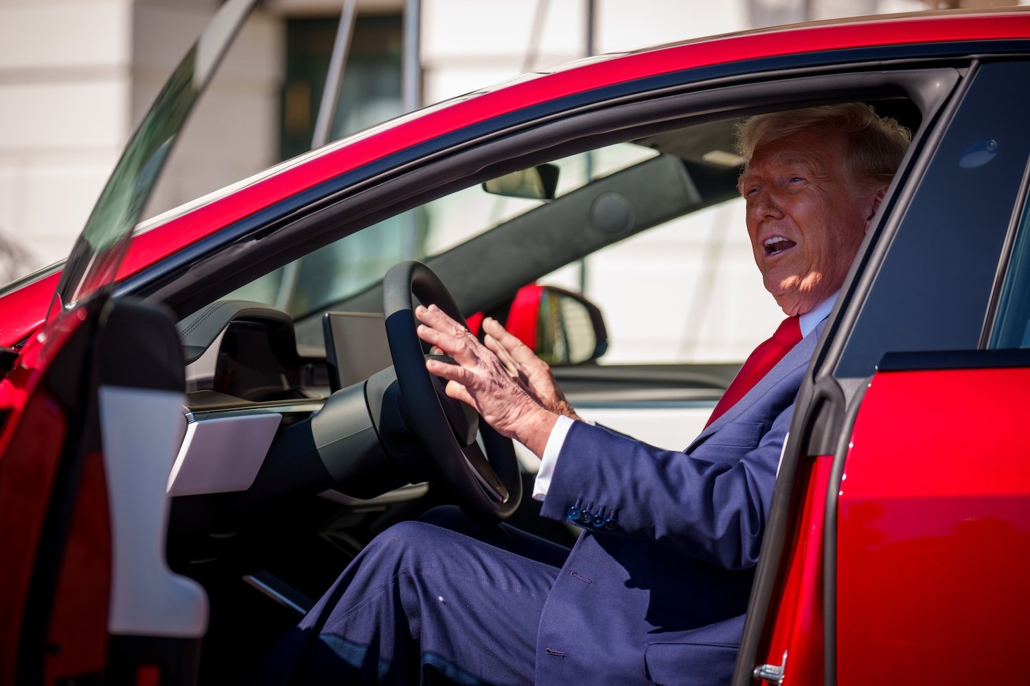Donald Trump in a Tesla