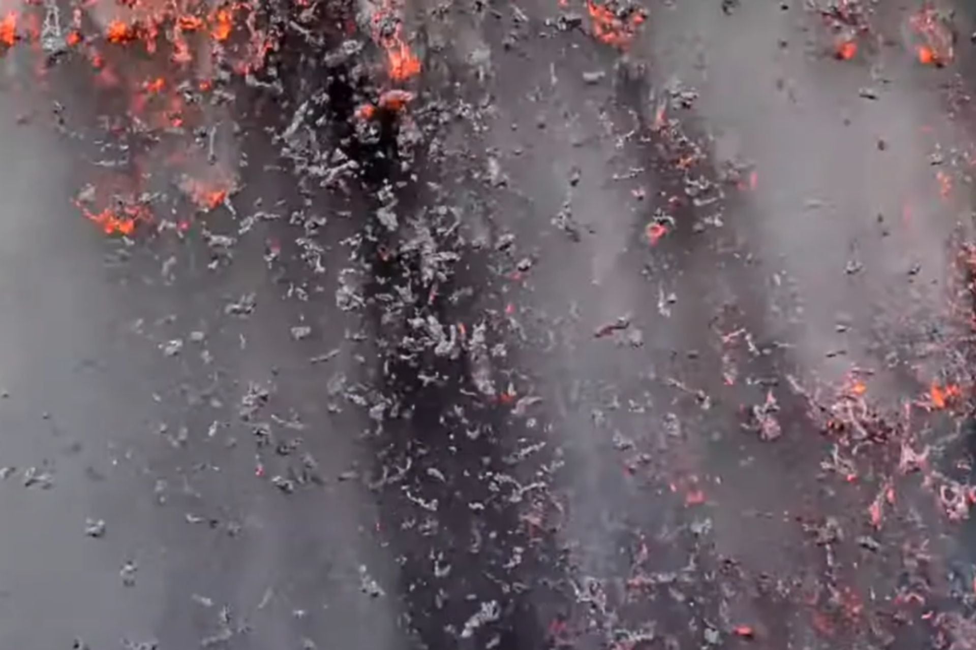Ash and tephra raining down from a lava fountain as Kilauea erupts